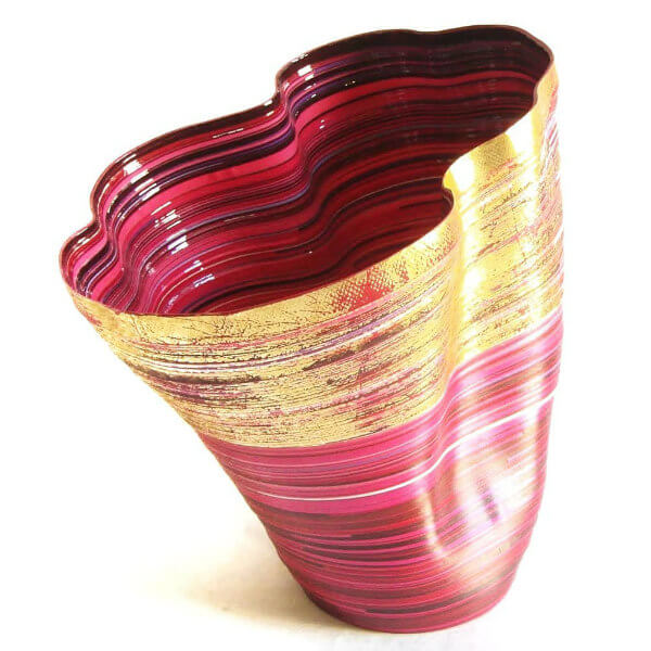 red and metallic gold vase made of narrow paper strips