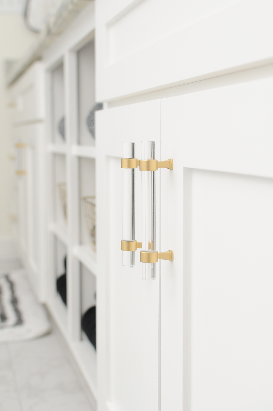 DIY tutorial on how to turn chrome and lucite cabinet pulls and hardware into a brushed satin gold finish. Perfect for bathrooms and kitchens.
