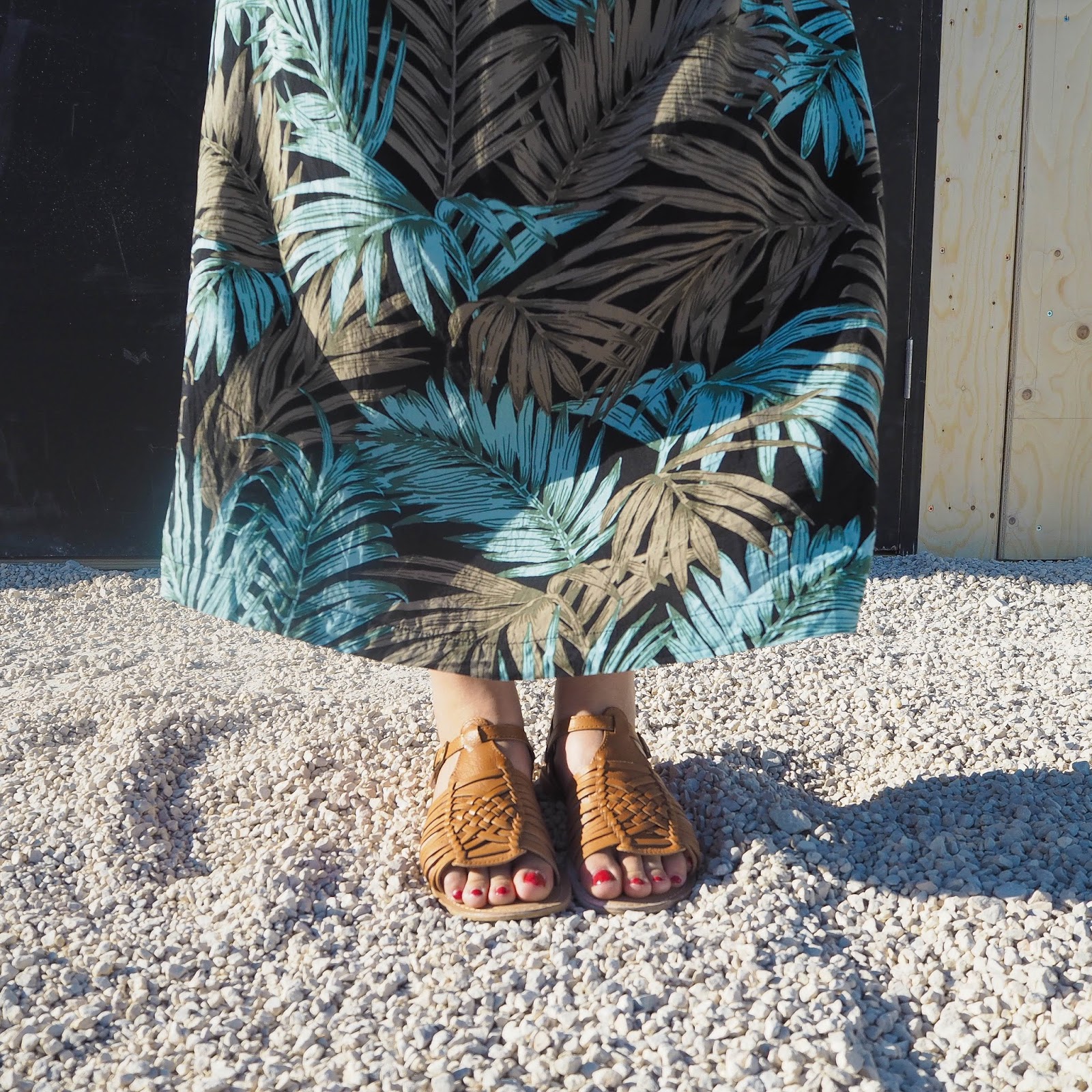 Palm print maxi dress and tan sandals