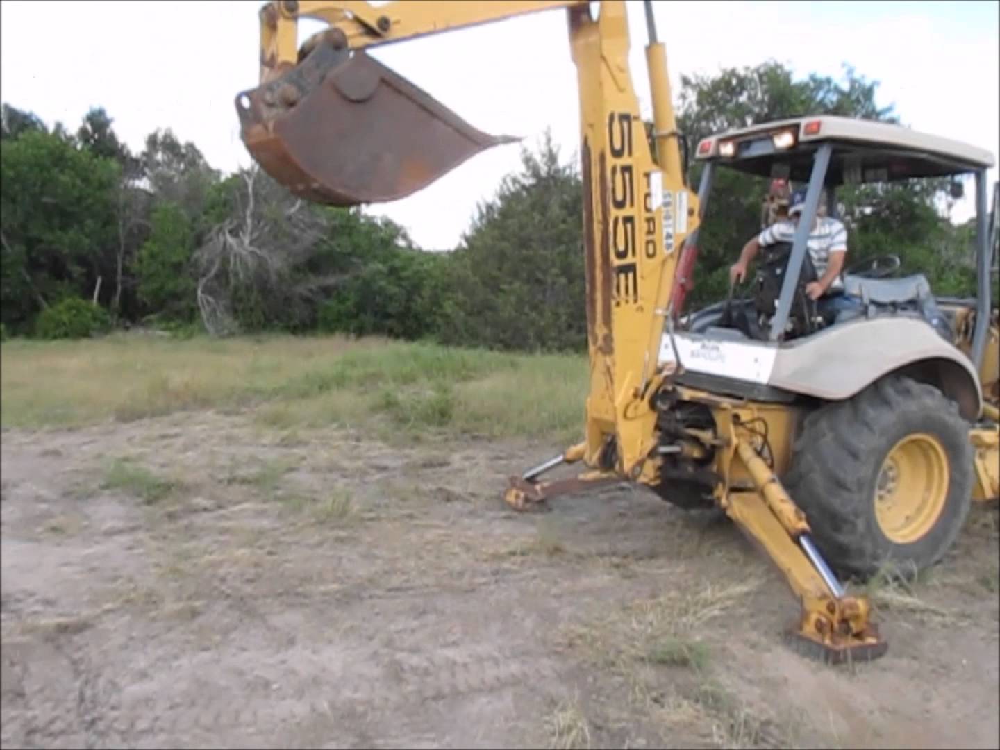 How to Operate the Back Boom on a Backhoe Electronic And Mechanic