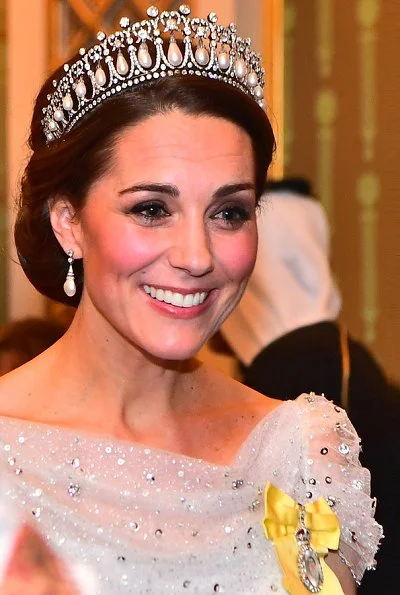 The Duchess of Cambridge wearing Lover's Knot tiara with a pale blue, fitted bespoke Jenny Packham gown