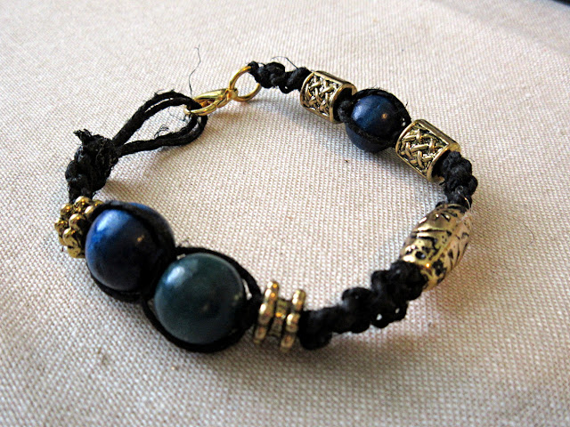 A black and gold woven hemp pi bracelet. Math jewelry is a unique gift for graduation, birthdays, or teachers!