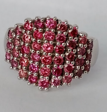 http://www.bigrocksbyvicki.com/pink-diamond-deco-ring-cocktail-ring-14-kt-white-gold/#.WMDi-vF9600