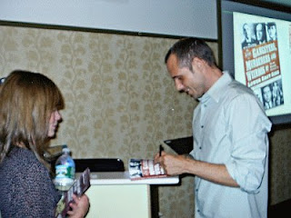 Eric Ferrara signing books at the Tenement Museum