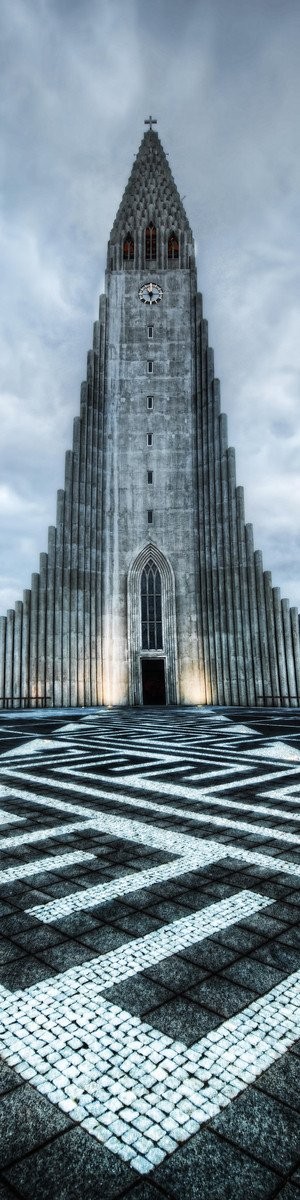The Hallgrímskirkja is a Lutheran (Church of Iceland) parish church in Reykjavík, Iceland. At 74.5 metres (244 ft), it is the largest church in Iceland and the sixth tallest architectural structure in Iceland after Longwave radio mast Hellissandur, the radio masts of US Navy at Grindavík, Eiðar longwave transmitter and Smáratorg tower. The church is named after the Icelandic poet and clergyman Hallgrímur Pétursson (1614 to 1674), author of the Passion Hymns.  State Architect Guðjón Samúelsson's design of the church was commissioned in 1937. He is said to have designed it to resemble the basalt lava flows of Iceland's landscape. It took 38 years to build the church. Construction work began in 1945 and ended in 1986, the landmark tower being completed long before the church's actual completion. The crypt beneath the choir was consecrated in 1948, the steeple and wings were completed in 1974, and the nave was consecrated in 1986. Situated in the centre of Reykjavík, it is one of the city's best-known landmarks and is visible throughout the city. It is similar in style to the expressionist architecture of Grundtvig's Church of Copenhagen, Denmark, completed in 1940.  The church houses a large pipe organ by the German organ builder Johannes Klais of Bonn. It has mechanical action, four manuals and pedal, 102 ranks, 72 stops and 5275 pipes. It is 15 metres tall and weighs 25 tons. Its construction was finished in December 1992. It has been recorded by Christopher Herrick in his Organ Fireworks VII CD.