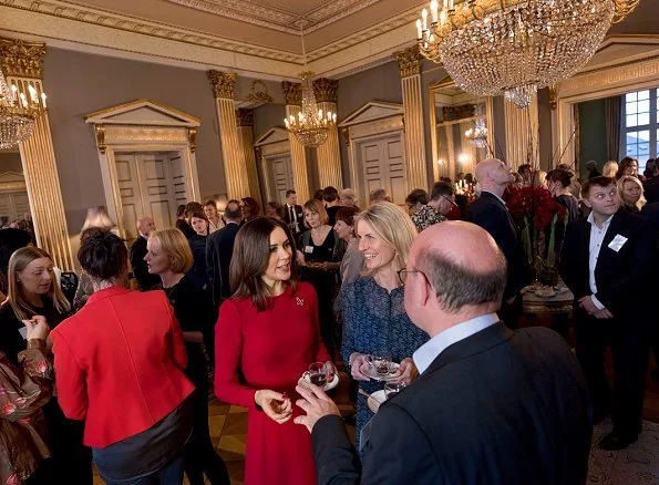 Crown Princess Mary wore a Dolce & Gabbana dress. Prada Pumps at Mary Fonden's Christmas reception