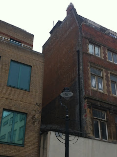 Ghost sign on the side of a building in Lower Marsh, London SE1
