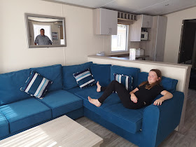 girl relaxing on caravan sofa