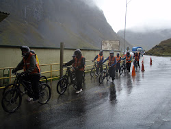 Nasty freezing conditions, now on bikes, below summit -- Road of Death