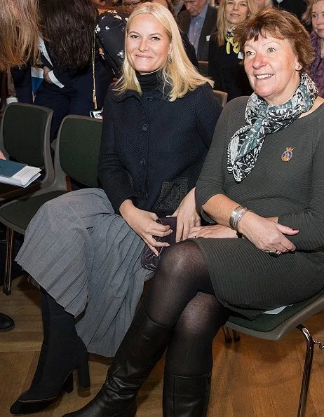 Women's Leadership for Sustainable Development. Princess Mette-Marit wore Prada Jacket, Prada boots and clutch