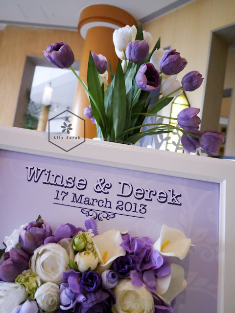 purple wedding reception decoration and welcome board