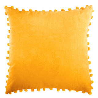 http://www.raggedrose.com/product/gold-velvet-pom-pom-cushion/