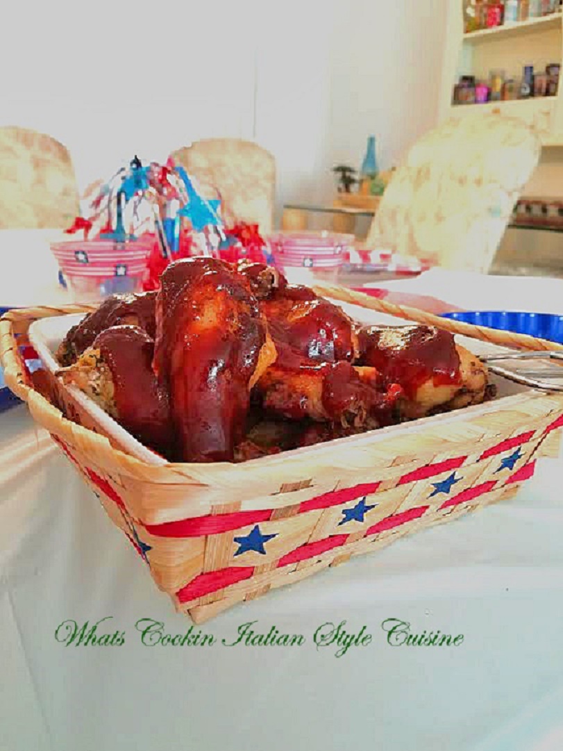 this is a delicious style barbecued baked chicken homemade sauce that is perfect for pork or chicken, beef and whatever you love barbecue sauce on. This is on chicken in a white bird corning ware dish made back in the 1970's.  Served on the 4th of July holiday basket