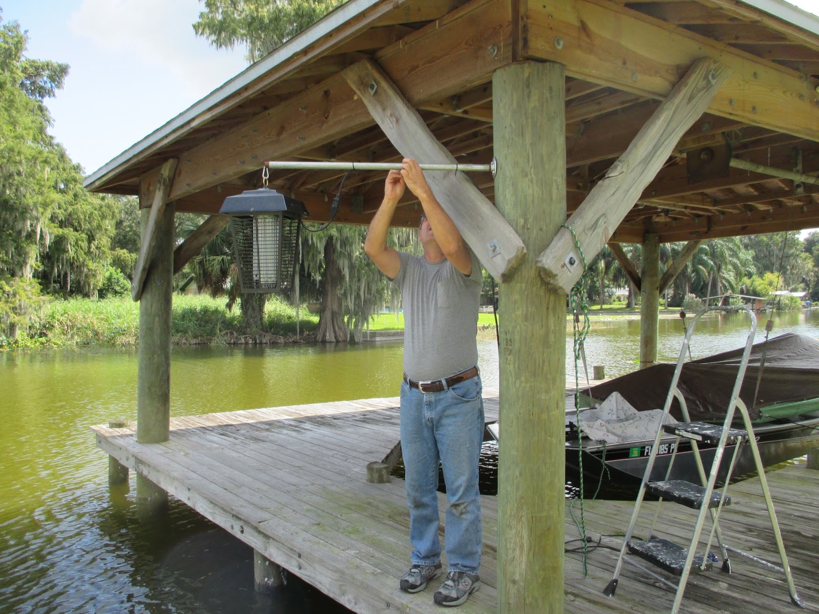 Mike and Lisa's World Spraying The Spanish Moss