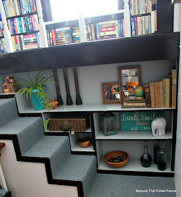 a built in bookshelf painted gray