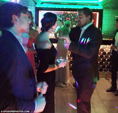 4 Actor Leonardo DiCaprio can't keep his eyes or hands off mystery lady at party (photos)