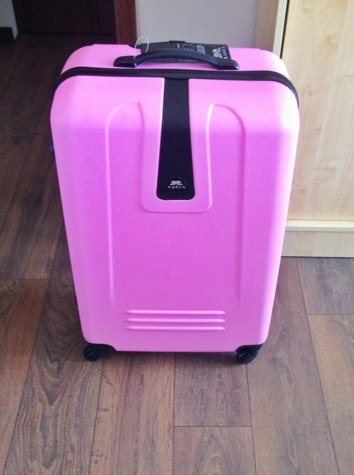 Big pink suitcase Fewer, better things