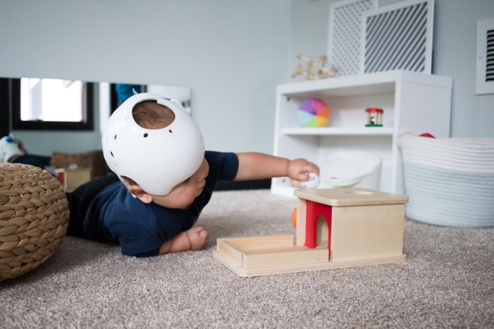 A look at this popular Montessori baby toy -- the object permanence box! 