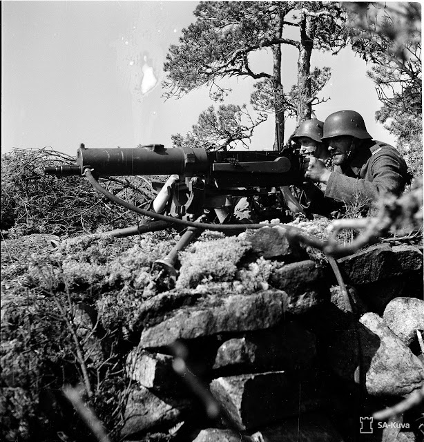 Finnish soldiers manning a Maxim machine gun, 2 August 1941 worldwartwo.filiminspector.com