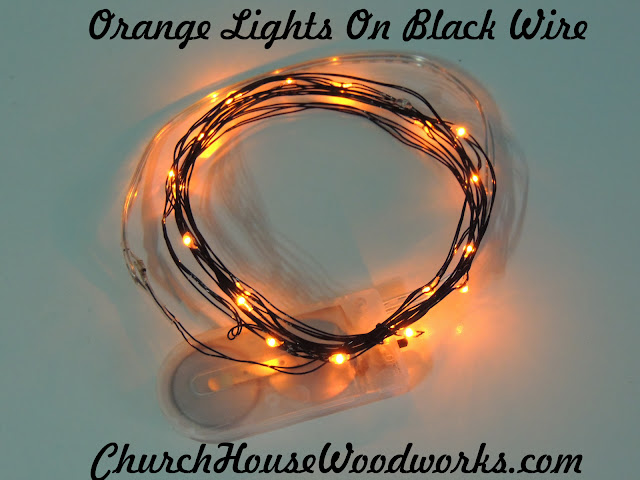 Orange Lights On Black Wire LED Battery Operated String Lights