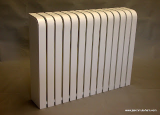 A white designer radiator cover
