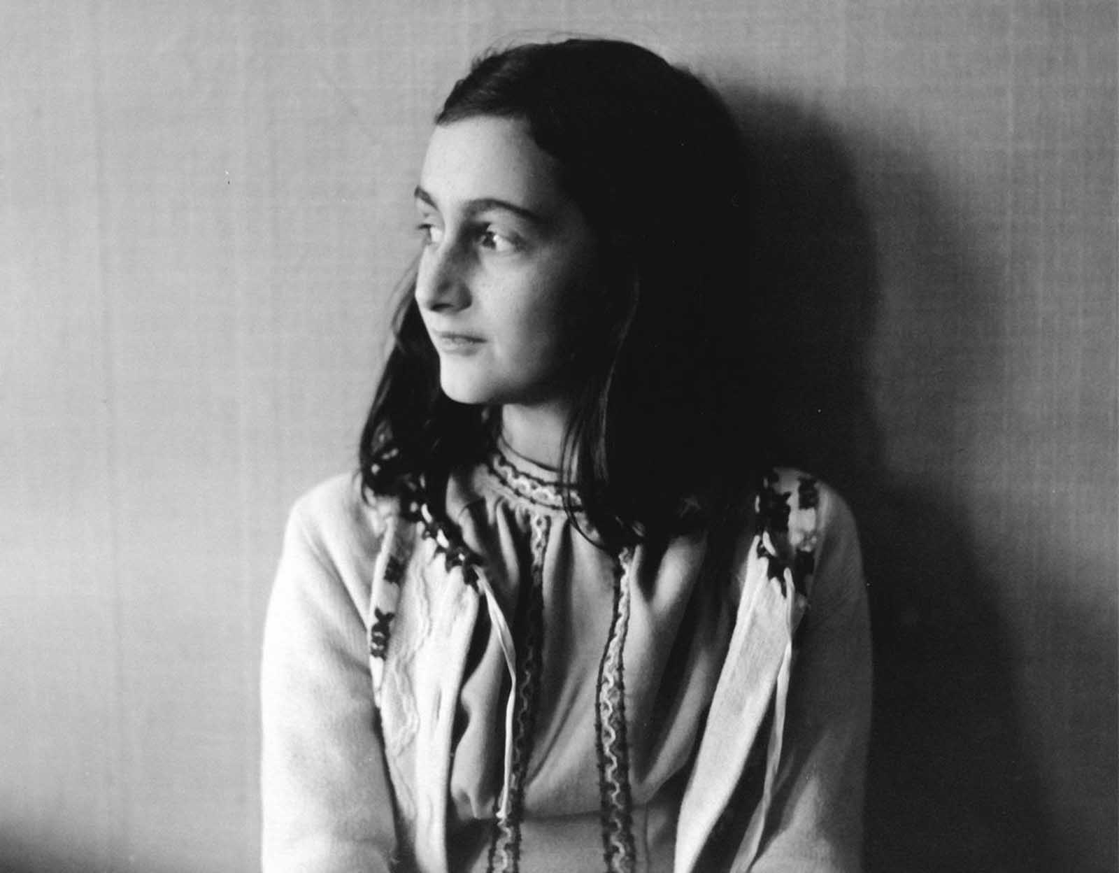 Anne Frank poses in 1941 in this photo made available by Anne Frank House in Amsterdam, Netherlands. In August of 1944, Anne, her family and others who were hiding from the occupying German Security forces, were all captured and shipped off to a series of prisons and concentration camps. Anne died from typhus at age 15 in Bergen-Belsen concentration camp, but her posthumously published diary has made her a symbol of all Jews killed in World War II.