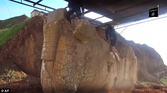 ISIS thugs take a hammer to civilisation Priceless 3,000-year-old artworks smashed to pieces in minutes as militants destroy Mosul museum