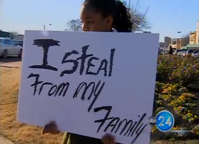 VIDEO - THIEVING GIRL, 13 FORCEDO TO HOLD :  'i steal from my family' SIGN AT BUSY INTERSECTION
