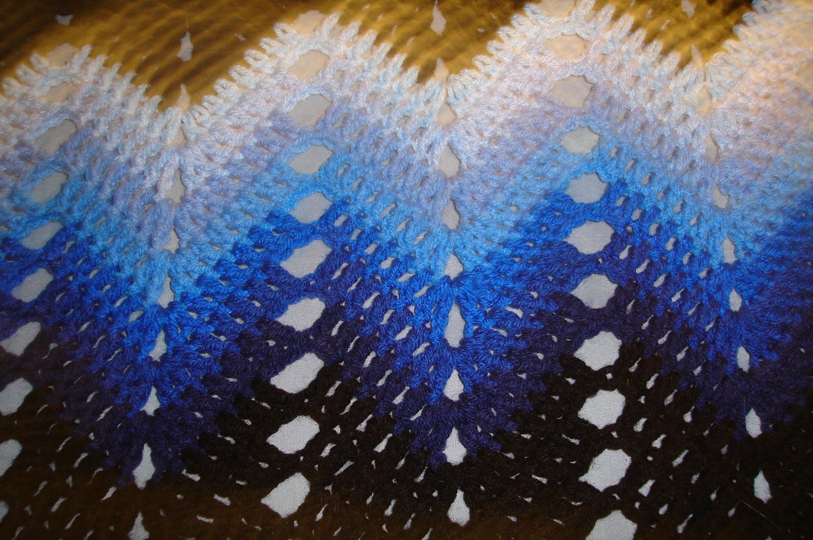 Two Needles and a Hook Hand crocheted king size bedspread in blues and