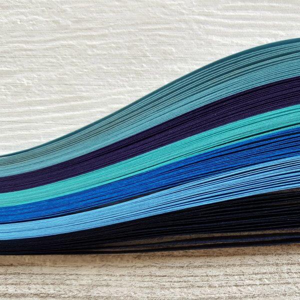 quilling strips in shades of blue