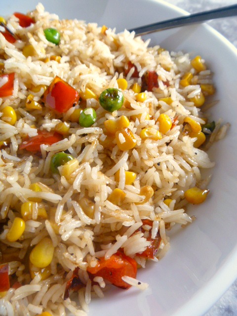 Beth's Confetti Rice:  Spicy sweet bell pepper, tender peas, crisp sweet corn, and sweet onion are combined with the heavenly rice and sprinkled with cilantro for extra flavor.  Amazing!  This is the PERFECT rice to serve with any grilled meat.  Slice of Southern