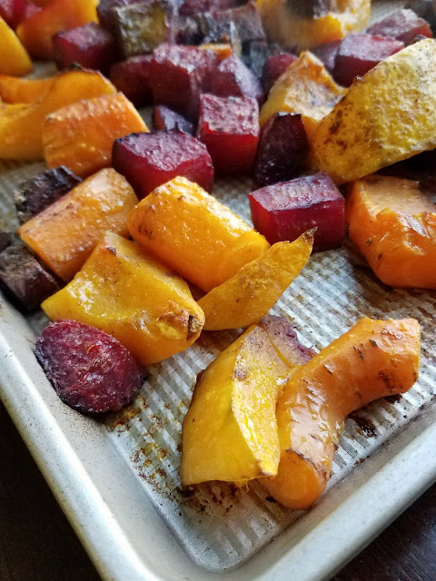 Roasted fall vegetables are made perfectly tender and lightly caramalized with a hint of Chinese five spice to give them that extra something. It's a delicious fall side dish. large chunks of squash, carrots and beets roasted on sheet pan
