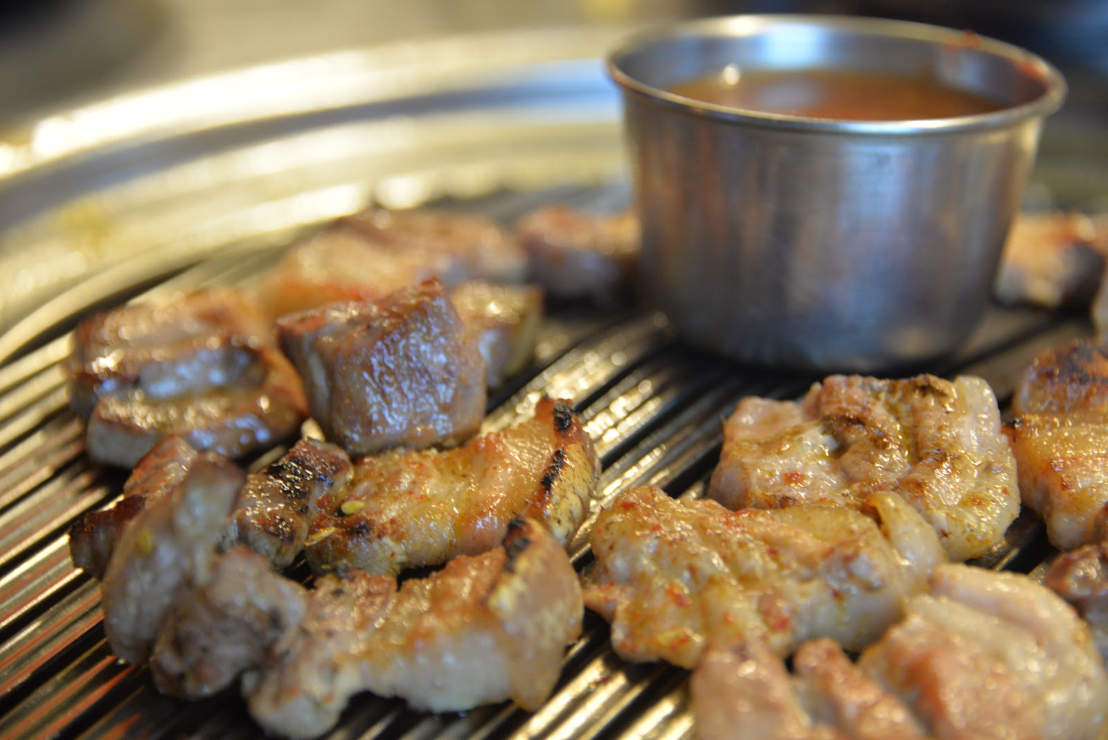 Suitcase and World Savoring a Jeju Island Delicacy. Black Pork.