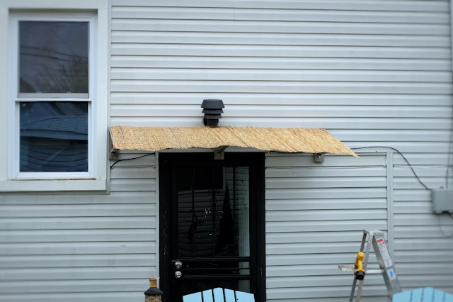 placing reeding over plastic for awning