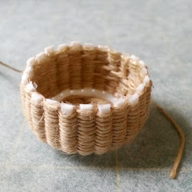 One-twelfth scale miniature almost-completed basket weaving kit.