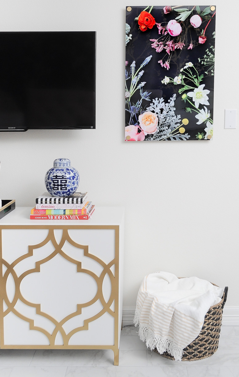 The Flora print from Jenny's Print Shop looks gorgeous flanking a TV in a master bedroom. Love this TV gallery wall idea.