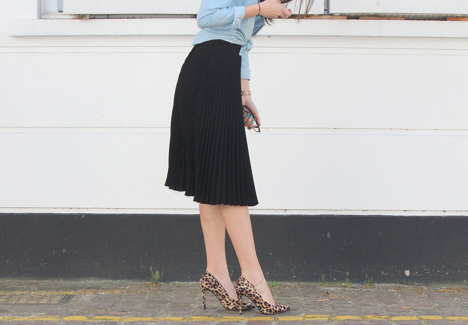 peexo fashion blogger wearing pleated midi skirt with lace bralet and denim shirt and leopard print heels in spring