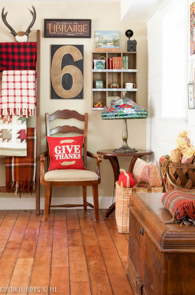 DIY ladder with plaid blankets and quilts and gallery wall - www.goldenboysandme.com