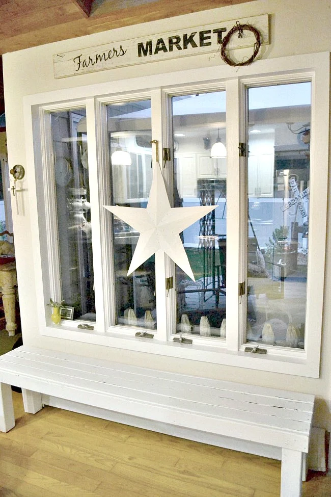 bench under large window with a star