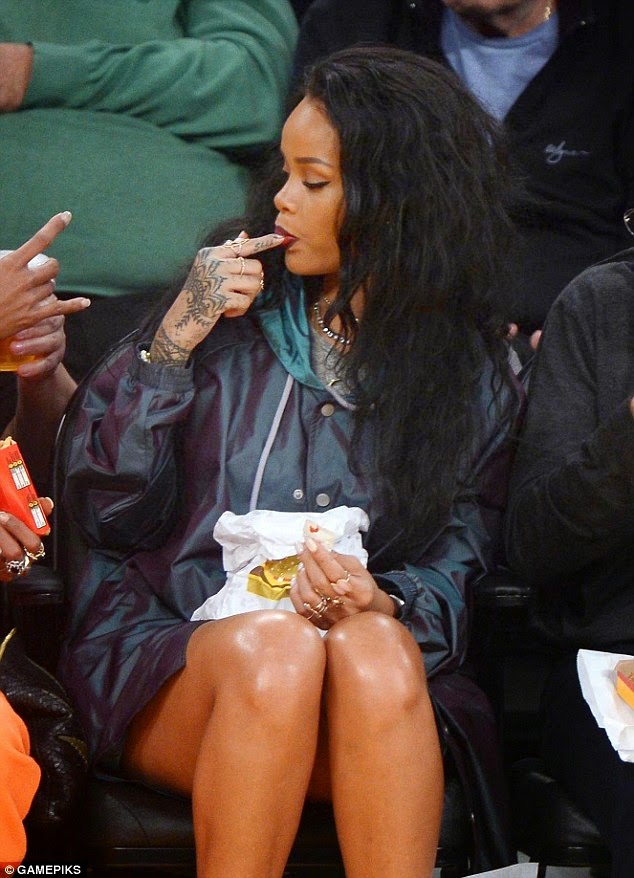 Rihanna enjoying the licks of the snack