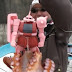 Man uses Char's Zaku Action Fig for Fishing