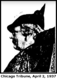 Low-quality newspaper picture of a white woman, in profile, with short curly light-colored hair and a dark hat coming to a sharp peak at the back