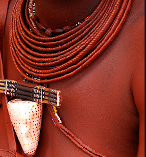 African Himba covers their skin and hair  with a creamy mixture of fat and red clay