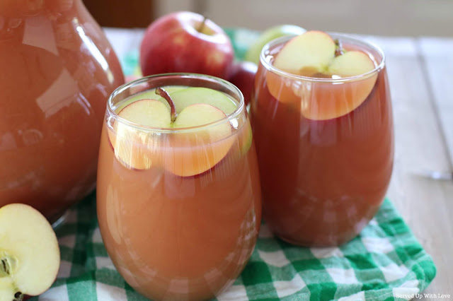 Apple pear and orange flavored party punch in glass