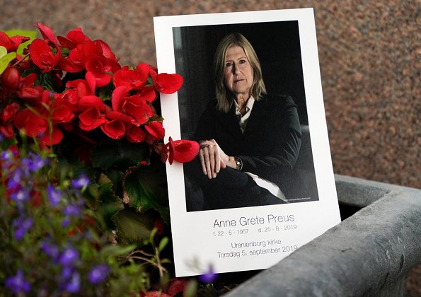 Funeral of Norwegian musician Anne Grete Preus, held at Uranienborg Church in Oslo. Black v-neck half sleeve midi dress