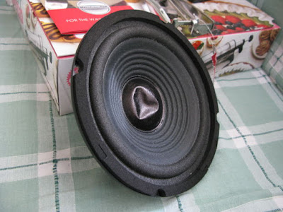 unpush speaker dented cone on speaker in the middle 