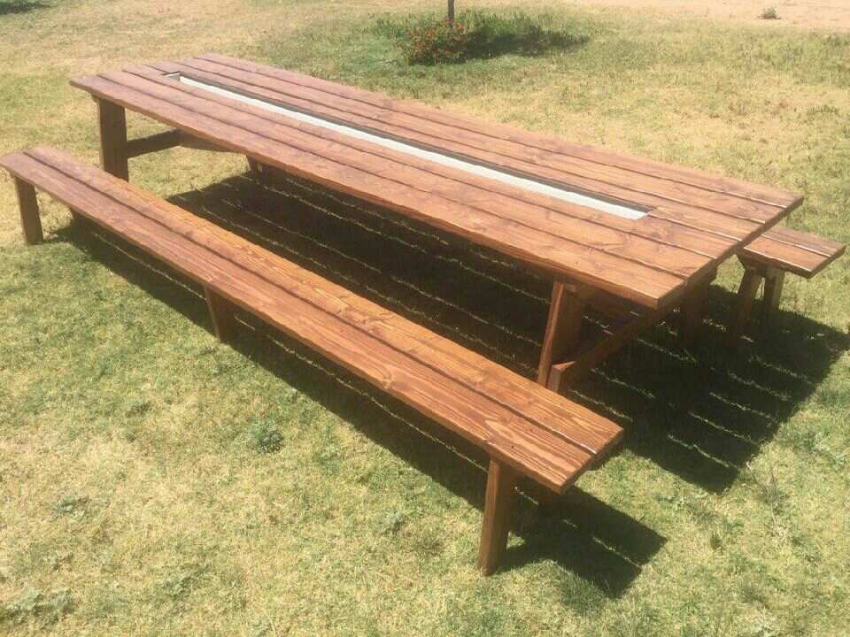 The Rusty Roost Ultimate Party Picnic table with ice cooler center