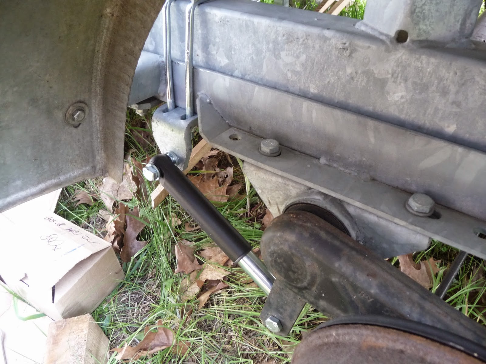 We sail Phobos 21 Adding shocks onto our trailer