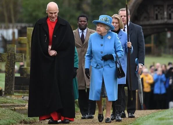 Queen Elizabeth wears her Canadian snowflake brooch. This Sapphire brooch was given to the Queen on behalf of the Canadian people