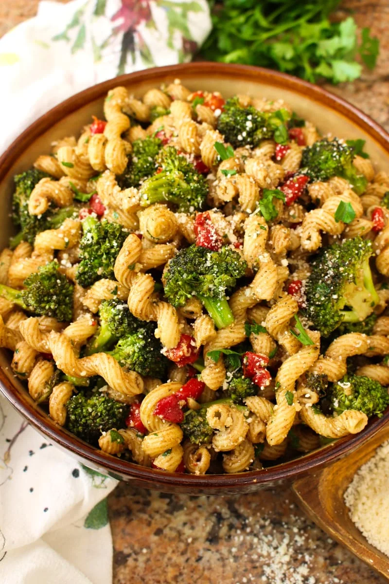 This Broccoli Pasta Salad is the perfect summer side dish for broccoli lovers! Tender-crisp pan-seared broccoli florets are tossed with cavatelli pasta, roasted red peppers, parmesan cheese, and zippy balsamic vinegar in this unforgettable, party-perfect salad. #broccoli #sidedish #pastasalad